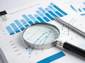 magnifying glass over graphs